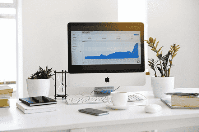 monitor on desk with office things around
