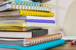 stack of different books - showing the back and binding